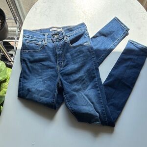 Levi’s Mile High Super Skinny Distressed Medium-Dark Denim Jeans